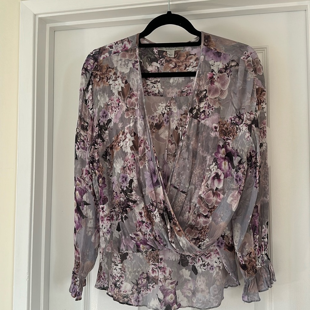 All Saints Aus draped in the front and lower in the back